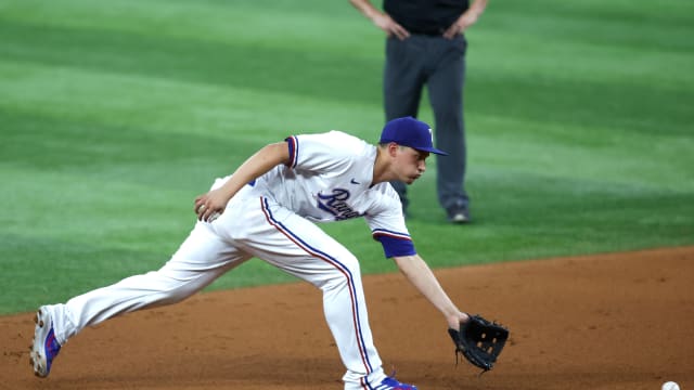 Aug 14, 2023; Arlington, Texas, USA; Texas Rangers shortstop Corey Seager (5) fields a ground ball in the fourth inning against the Los Angeles Angels at Globe Life Field. Mandatory Credit: Tim Heitman-USA TODAY Sports  